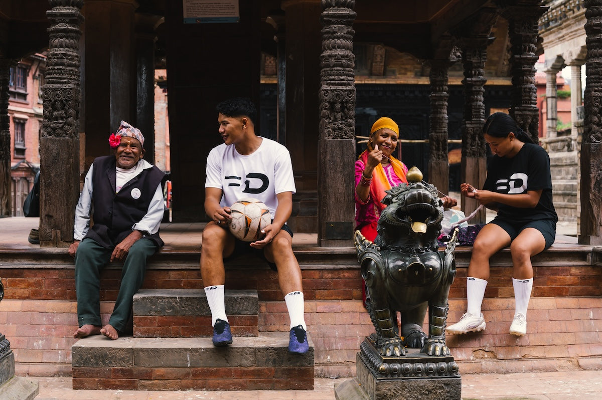 Ball Driven apparel worn alongside local residents at a temple courtyard in Nepal